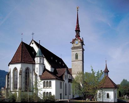 Die Pfarrkirche St. Peter und Paul sowie das dazugehörende Beinhaus zählen zu den bedeutungsvollsten kirchlichen Baudenkmälern der Innerschweiz. 
Die Kirche wird erstmals im Jahr 1226 urkundlich erwähnt Bereits im Jahre 877 soll jedoch an der Stelle der heutigen Kirche ein Gotteshaus gestanden haben. Die Kirche war bis 1714 Mutterkirche des ganzen Aegeritals. Ihre heutige Form erhielt sie 1905 unter Beibehaltung spätgotischer Teile des Vorgängerbaus und des Kirchturms. 
Die Kirche wurde 1975/76 restauriert und unter eidgenössischen Denkmalschutz gestellt.